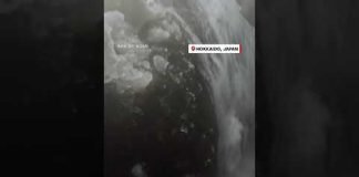 Skier tumbles into hidden waterfall