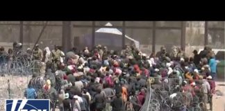 WATCH: Hundreds of migrants breach razor and rush the US border