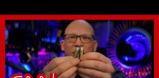 Weapons expert shows difference between live rounds and dummy rounds used on movie sets