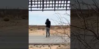 ‘Let us cross!’: Migrants try to get through US border wall