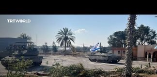 Israel takes control of Rafah crossing as truce talks continue