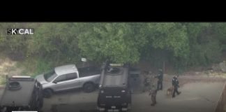 Officers in standoff with murder suspect in Irvine