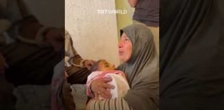 Palestinian mother bids emotional farewell to her son killed in Rafah