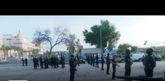 Police form skirmish line outside of Pomona College graduation after scuffle with protesters