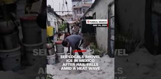 See locals shovel ice in Mexico after hail falls amid a heat wave