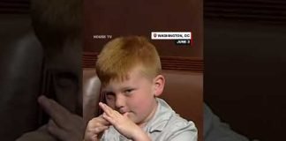 Congressman's son pulls funny faces behind dad during House floor speech
