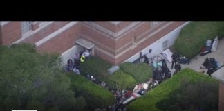 Droves of police respond to pro-Palestinian protesters marching across UCLA campus