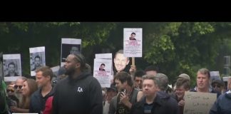 Family and friends of the late Johnny Wactor march Downtown Los Angeles