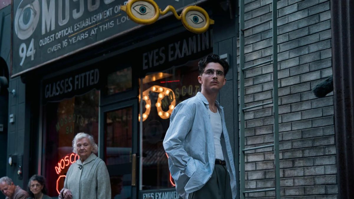 Timothée Chalamet in a thought-provoking street scene, featured in our Marty Supreme movie review.